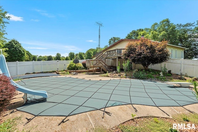 5016 Kinsinger Ln, Pleasant Plains, IL 62677 - view of pool featuring a fenced backyard, a diving board, a water slide, a patio area, and stairs