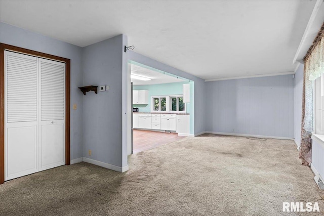 7971 Mechanicsburg Rd, Springfield, IL 62707 - unfurnished living room featuring carpet floors and baseboards