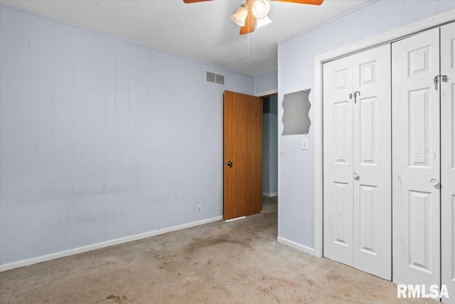 7971 Mechanicsburg Rd, Springfield, IL 62707 - unfurnished bedroom featuring carpet floors, a closet, and a ceiling fan
