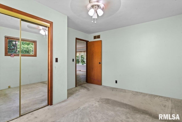 7971 Mechanicsburg Rd, Springfield, IL 62707 - unfurnished bedroom featuring carpet floors, a closet, and ceiling fan