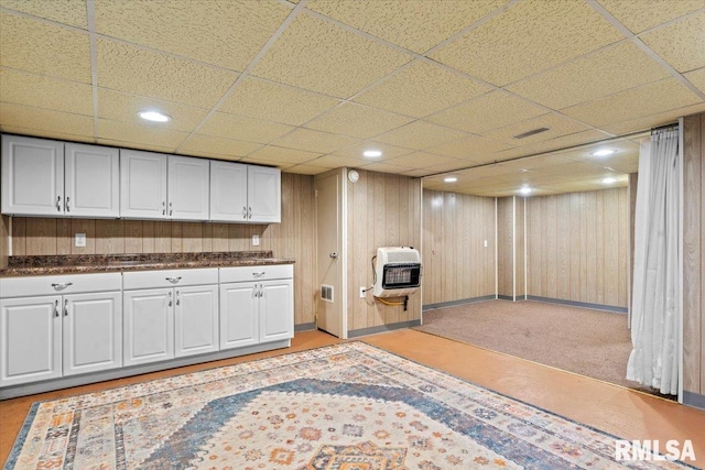 7971 Mechanicsburg Rd, Springfield, IL 62707 - kitchen with heating unit, a paneled ceiling, dark countertops, and white cabinets