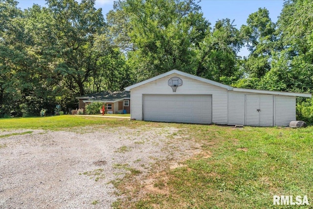7971 Mechanicsburg Rd, Springfield, IL 62707 - garage featuring view of wooded area