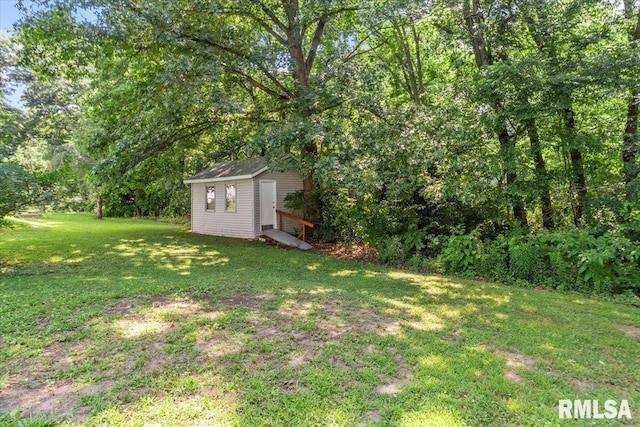 7971 Mechanicsburg Rd, Springfield, IL 62707 - view of green lawn featuring a storage unit