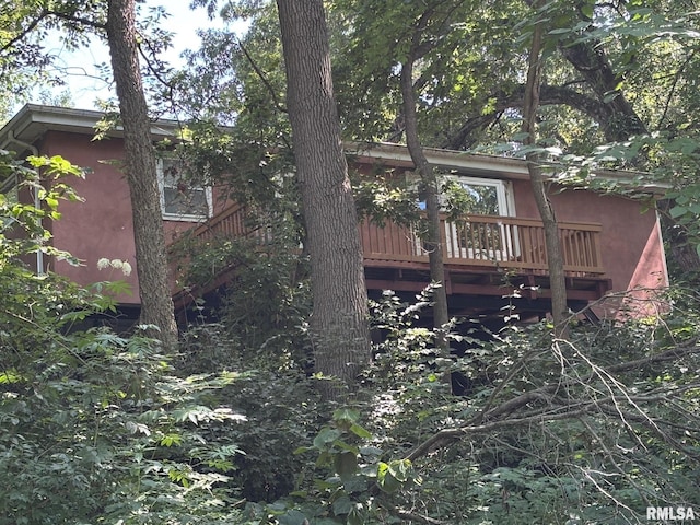 7971 Mechanicsburg Rd, Springfield, IL 62707 - back of house featuring stucco siding and a wooden deck