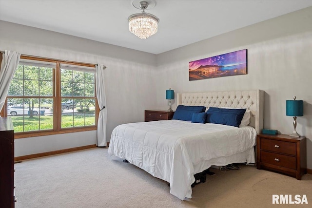 345 Country Towne Rd, Springfield, IL 62712 - bedroom with carpet floors and a chandelier