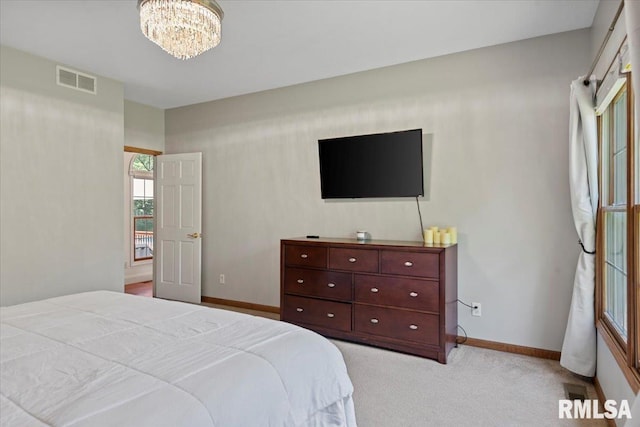 345 Country Towne Rd, Springfield, IL 62712 - bedroom with a chandelier and light carpet