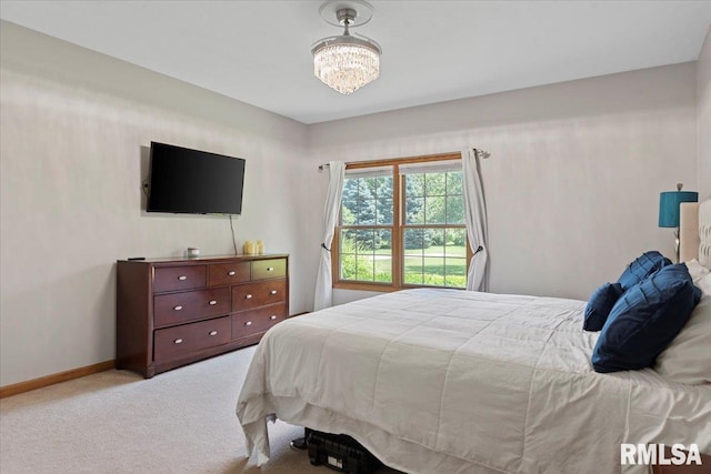 345 Country Towne Rd, Springfield, IL 62712 - carpeted bedroom featuring baseboards and a chandelier