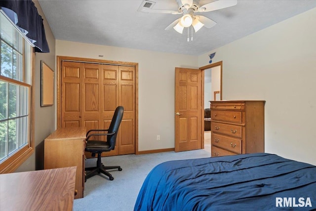345 Country Towne Rd, Springfield, IL 62712 - carpeted bedroom featuring multiple windows, a ceiling fan, and a closet