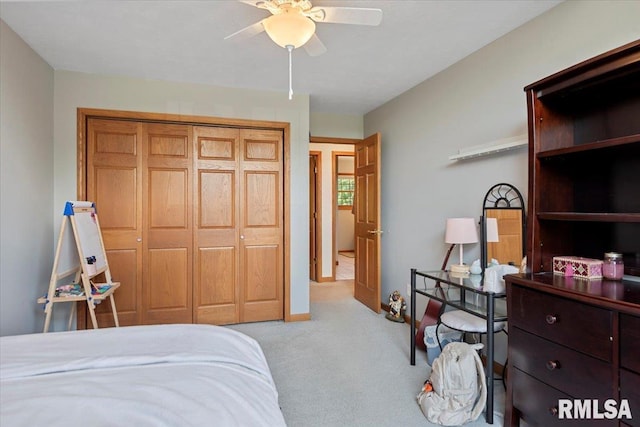 345 Country Towne Rd, Springfield, IL 62712 - bedroom featuring light colored carpet, a closet, and a ceiling fan