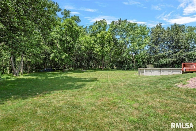 345 Country Towne Rd, Springfield, IL 62712 - view of grassy yard with an outdoor pool and a deck
