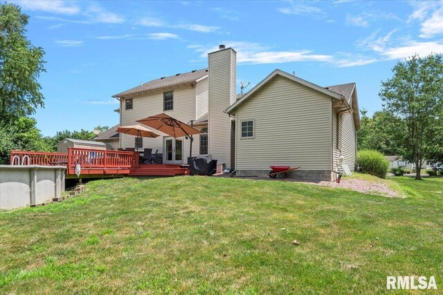 345 Country Towne Rd, Springfield, IL 62712 - back of house with a wooden deck, a yard, and a chimney