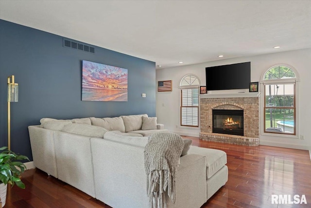 345 Country Towne Rd, Springfield, IL 62712 - living area with dark wood finished floors, recessed lighting, and a fireplace