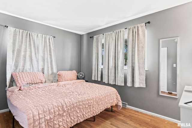 2208 E Black Ave, Springfield, IL 62702 - bedroom featuring baseboards and wood finished floors