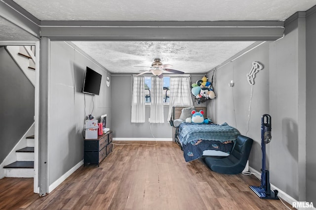 2208 E Black Ave, Springfield, IL 62702 - bedroom featuring a textured ceiling, wood finished floors, and a ceiling fan