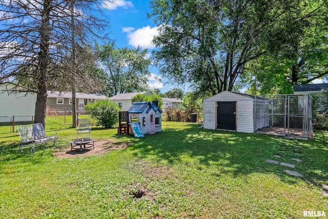 2208 E Black Ave, Springfield, IL 62702 - view of yard with a shed and an outdoor fire pit