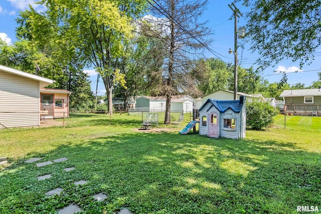 2208 E Black Ave, Springfield, IL 62702 - fenced backyard featuring a storage unit and a fire pit