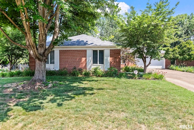 1613 Denison Dr, Springfield, IL 62704 - ranch-style house with brick siding, concrete driveway, and an attached garage