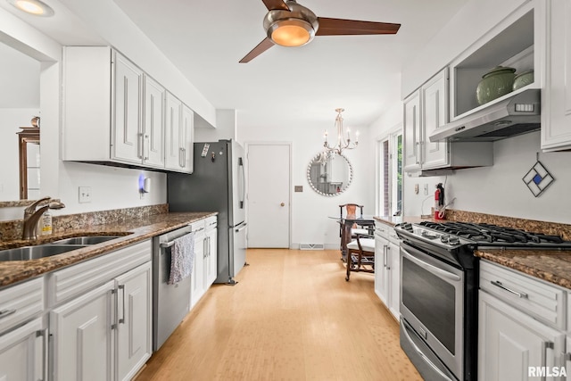 1613 Denison Dr, Springfield, IL 62704 - kitchen featuring stainless steel appliances, extractor fan, ceiling fan, light wood finished floors, and white cabinets