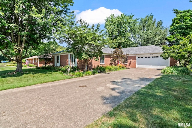 1613 Denison Dr, Springfield, IL 62704 - ranch-style home featuring driveway, a garage, brick siding, and a front yard