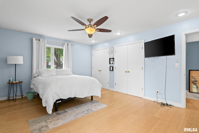 1613 Denison Dr, Springfield, IL 62704 - bedroom featuring light wood finished floors, multiple closets, ceiling fan, and recessed lighting