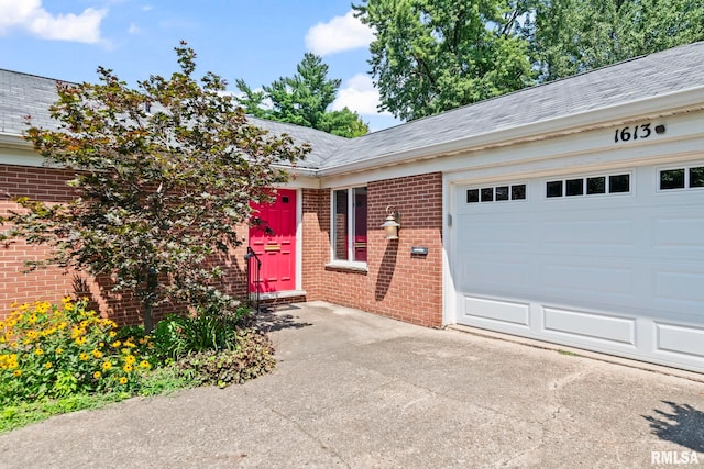 1613 Denison Dr, Springfield, IL 62704 - ranch-style home featuring brick siding, a shingled roof, a garage, and driveway