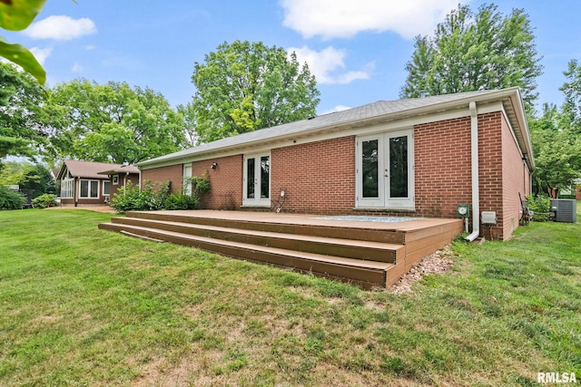 1613 Denison Dr, Springfield, IL 62704 - back of house featuring french doors, brick siding, a lawn, and a deck