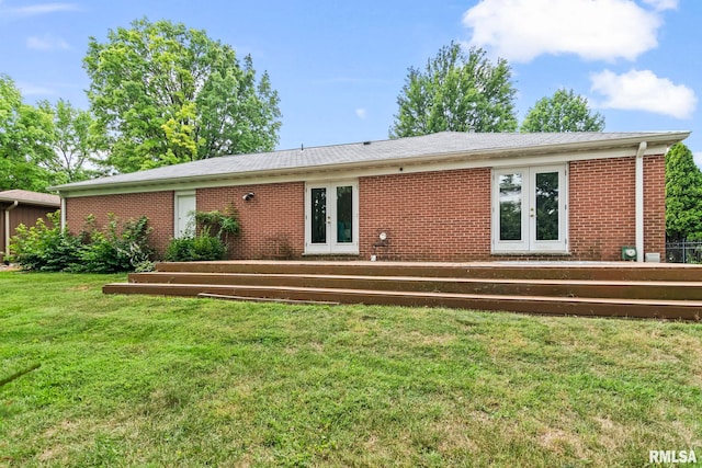 1613 Denison Dr, Springfield, IL 62704 - rear view of house featuring french doors, brick siding, and a lawn