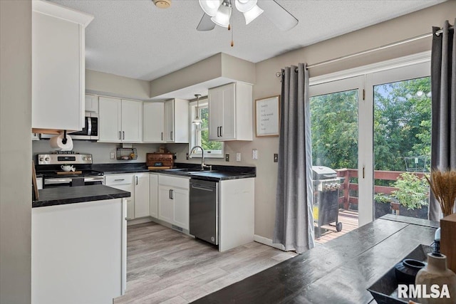 84 Chukar Dr, Chatham, IL 62629 - kitchen featuring appliances with stainless steel finishes, a ceiling fan, white cabinets, and a textured ceiling