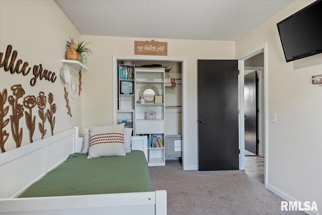84 Chukar Dr, Chatham, IL 62629 - bedroom with carpet flooring, a textured ceiling, and a closet