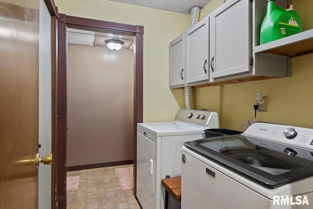 84 Chukar Dr, Chatham, IL 62629 - washroom with washer and dryer, cabinet space, and stone finish flooring