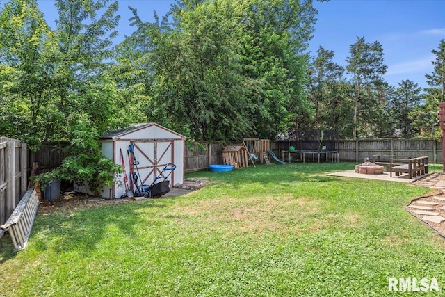 84 Chukar Dr, Chatham, IL 62629 - fenced backyard featuring an outdoor fire pit, a shed, and a playground