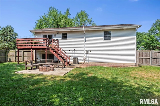 84 Chukar Dr, Chatham, IL 62629 - back of property with a wooden deck, a fire pit, a fenced backyard, stairway, and a patio