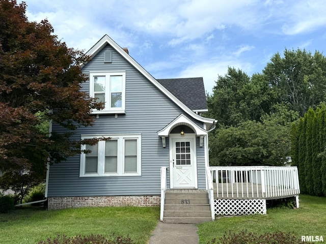 833 Willard St, Galesburg, IL 61401 - view of front facade with a deck, a front yard, and roof with shingles
