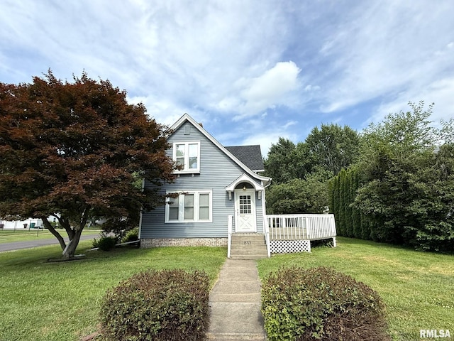 833 Willard St, Galesburg, IL 61401 - view of front of house with a front yard and a deck