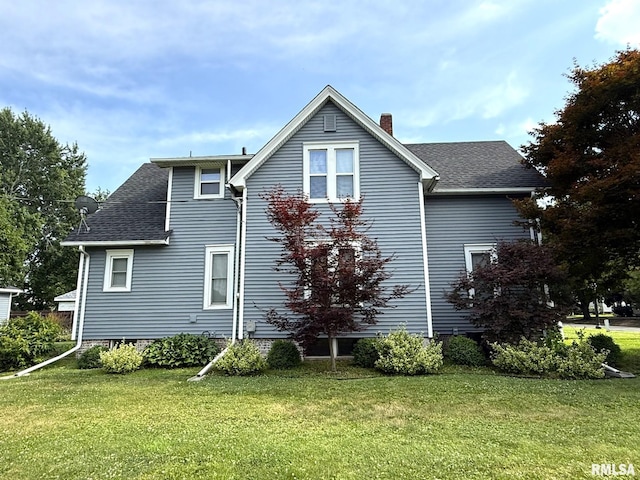 833 Willard St, Galesburg, IL 61401 - view of home's exterior with a chimney, a lawn, and roof with shingles