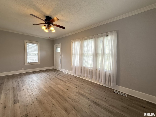833 Willard St, Galesburg, IL 61401 - unfurnished room featuring ceiling fan, crown molding, a textured ceiling, and hardwood / wood-style floors