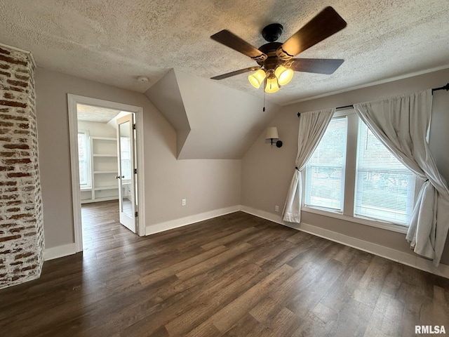 833 Willard St, Galesburg, IL 61401 - additional living space with a textured ceiling, dark wood finished floors, ceiling fan, and vaulted ceiling
