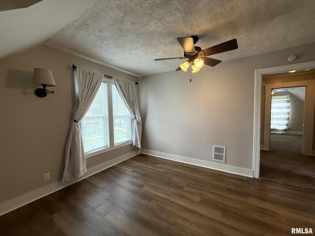 833 Willard St, Galesburg, IL 61401 - unfurnished room featuring dark wood finished floors, ceiling fan, plenty of natural light, a smoke detector, and a textured ceiling