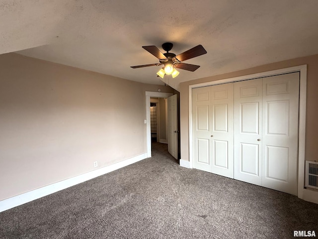 833 Willard St, Galesburg, IL 61401 - unfurnished bedroom featuring carpet flooring, a closet, and a ceiling fan