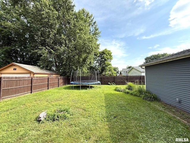 833 Willard St, Galesburg, IL 61401 - fenced backyard with a trampoline