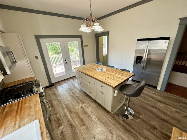 231 N Webster Ave, Jacksonville, IL 62650 - kitchen featuring stainless steel appliances, butcher block counters, white cabinets, dark wood-style flooring, and french doors