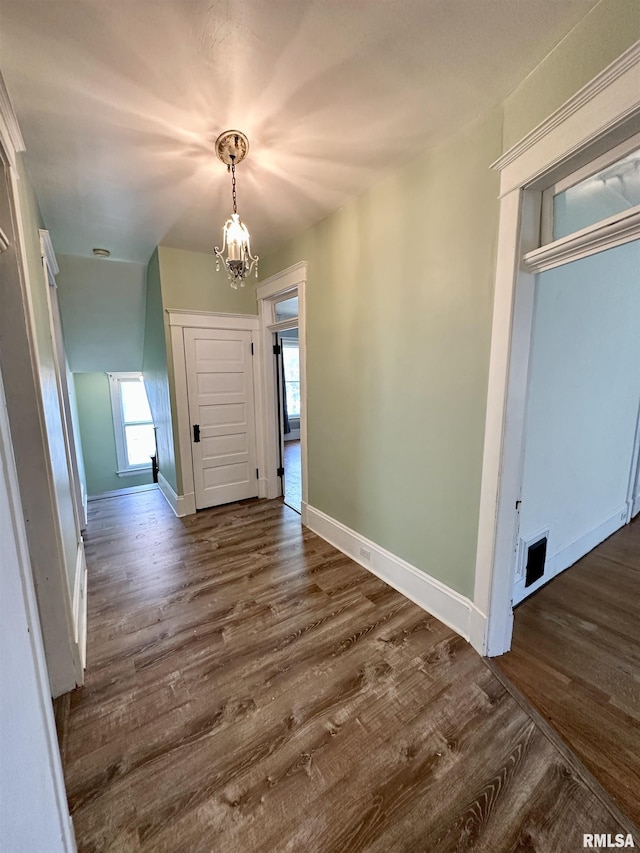 231 N Webster Ave, Jacksonville, IL 62650 - entrance foyer with a chandelier and dark wood-style floors