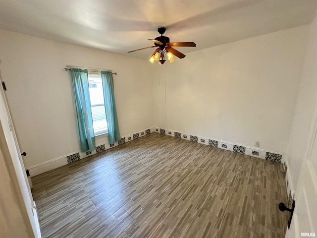 231 N Webster Ave, Jacksonville, IL 62650 - spare room with wood finished floors and ceiling fan