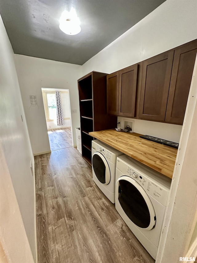 231 N Webster Ave, Jacksonville, IL 62650 - laundry area featuring washing machine and dryer, cabinet space, and wood finished floors