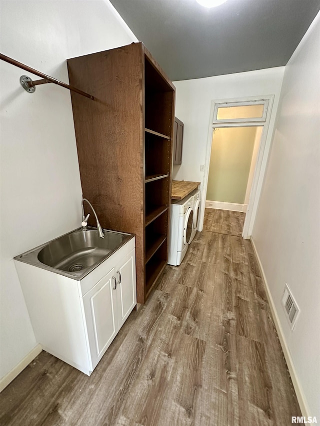 231 N Webster Ave, Jacksonville, IL 62650 - laundry area featuring washer / clothes dryer, dark wood-style flooring, and cabinet space