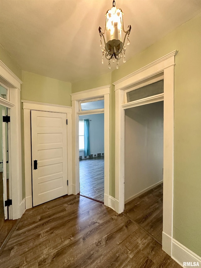 231 N Webster Ave, Jacksonville, IL 62650 - corridor featuring a chandelier and dark wood-style flooring