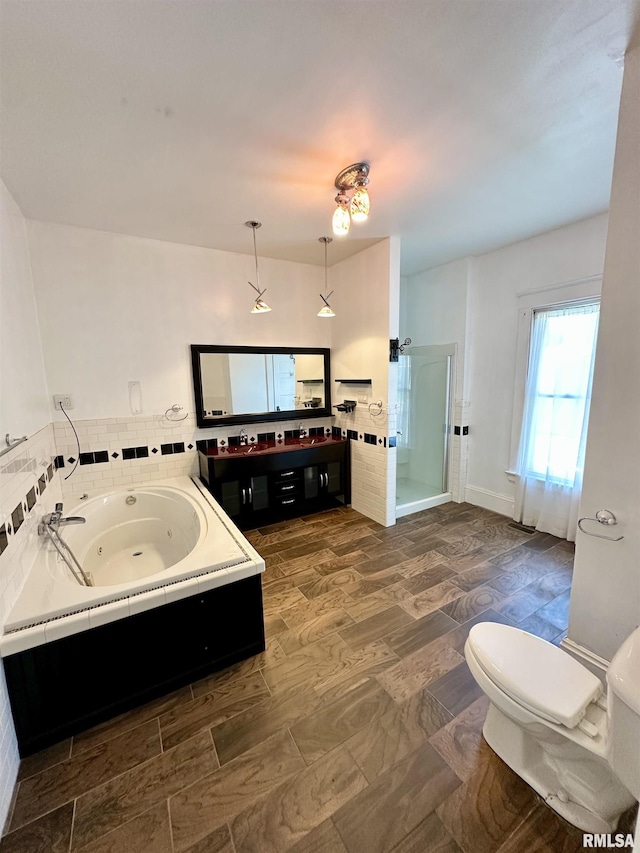 231 N Webster Ave, Jacksonville, IL 62650 - full bathroom featuring a shower stall, vanity, and a tub with jets