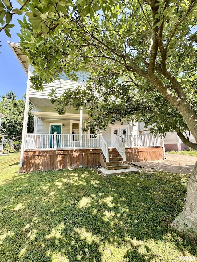 231 N Webster Ave, Jacksonville, IL 62650 - view of front of home featuring covered porch and a front lawn