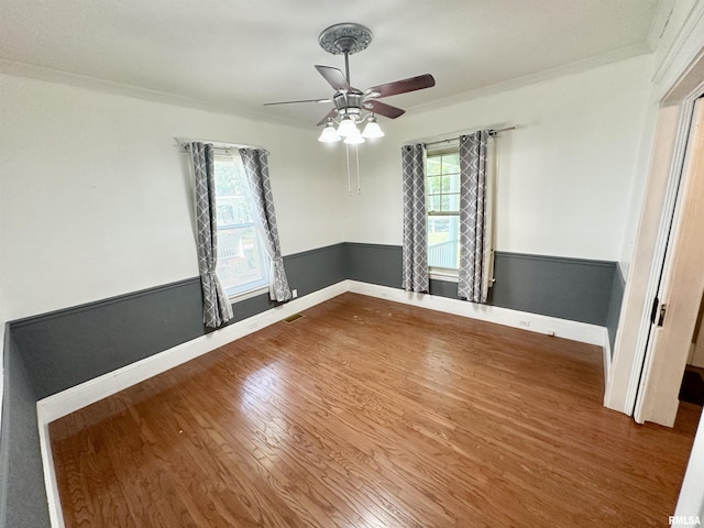 231 N Webster Ave, Jacksonville, IL 62650 - unfurnished room featuring wood finished floors, a ceiling fan, and ornamental molding