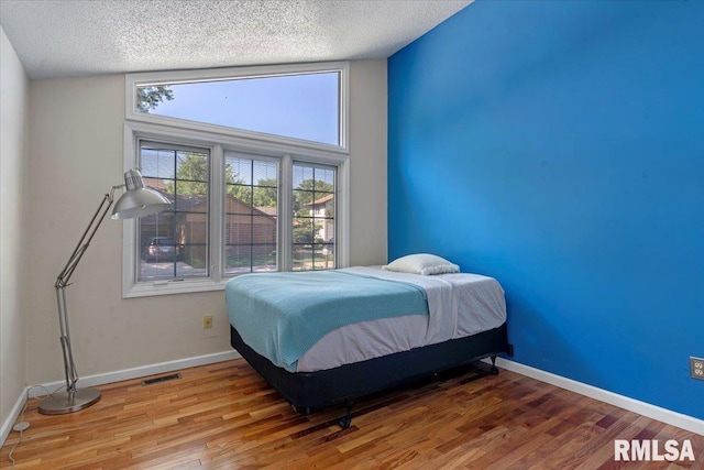 1009 Rickard Ct, Springfield, IL 62704 - bedroom featuring wood finished floors and a textured ceiling